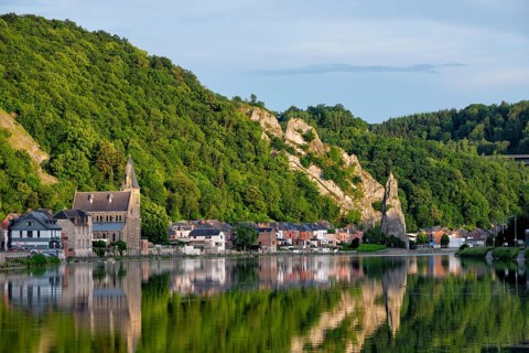 View of picturesque Dinant city over the Meuse river Dinant is a Walloon city and municipality located on the River Meuse