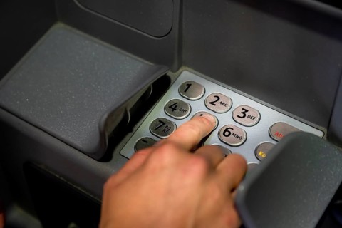 Hand at an ATM