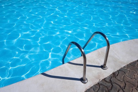 Metal ladder to swimming pool