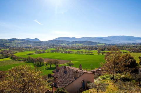 View of the green Umbrian countryside from the old town of Spello