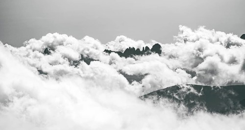 Clouds hanging between mountain peaks