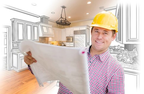 Smiling contractor holding blueprints over custom kitchen drawing and photo combination