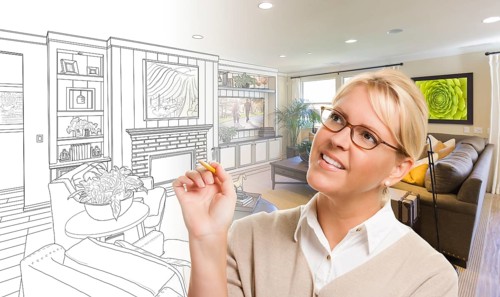 Woman with pencil over living room design drawing and photo combination
