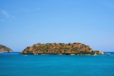 Island of Spinalonga with old fortress former leper colony and the bay of Elounda
