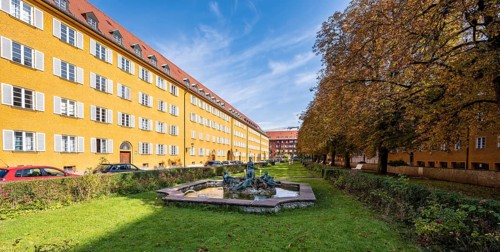 Inner courtyard with park and yellow apartment buildings