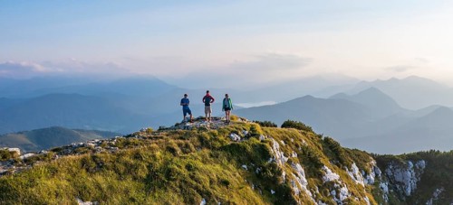 Three hikers at the summit