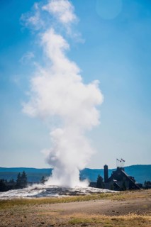 Old faithful geyser erupting at yellowstone national park