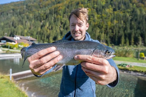 Man holding caught trout