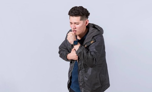 Man coughing on isolated background