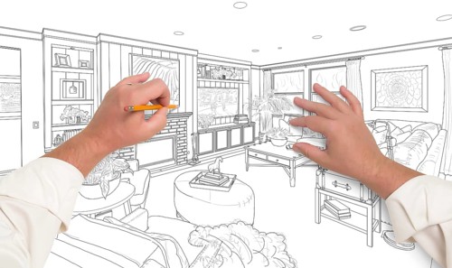 Male hands drawing custom living room design on white