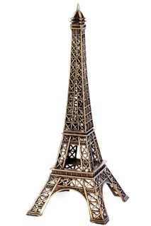 Small bronze copy of Eiffel tower figurine isolated on white background