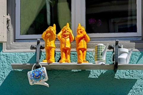 Three dwarfs at the window sill