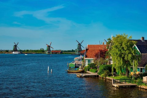 Netherlands rural lanscape Windmills at famous tourist site Zaanse Schans in Holland Zaandam