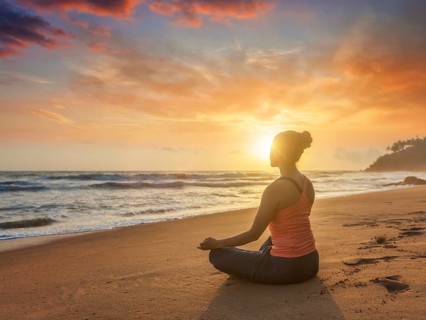 Young sporty fit woman doing yoga