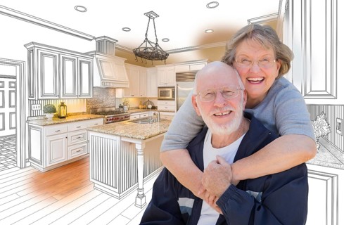 Happy senior couple over custom kitchen design drawing and photo combination