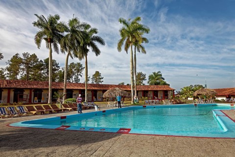 Man cleaning swimming pool