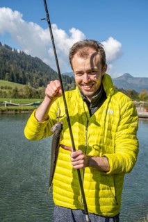 Man holding caught trout