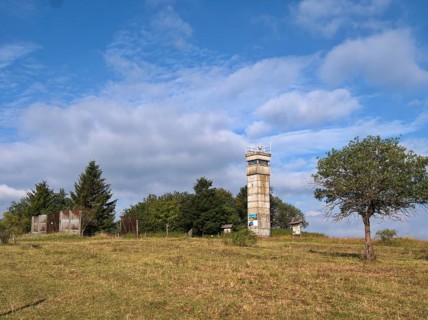 Old border tower and border installations in the High Rhoen on the Bavarian-Thuringian border near the core zone of the Rhoen Biosphere Reserve Berghoehe Schwarzes Moor