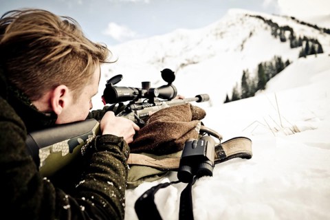 Hunter prepares to shoot. Mountain hunting Karwendel Mountains
