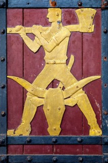 Historical figure on the door to the Ratskeller representing the trade of the butcher
