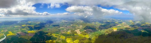 Panoramic view from a glider between the Baltic Sea and Lake Ploen. On the left the plane surface and Lake Ploen