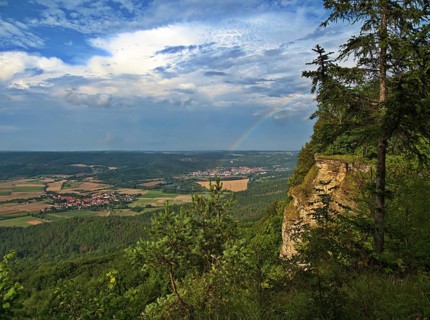 The edge of the Heldrastein in the Eichsfeld-Hainich-Werratal nature Park seen from the side Behind it is the Werratal with the villages of Heldra and Treffurt and Normannstein Castle Heldrastein