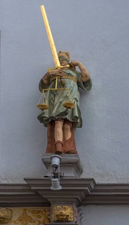 Renaissance figure of Justitia from 1568 above an entrance portal