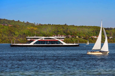 Car ferry Lodi and sailing boat