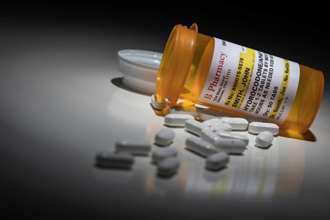 Hydrocodone pills and prescription bottle with non proprietary label. no model release required