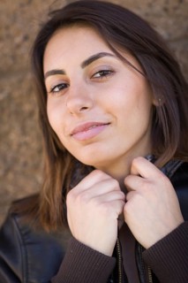 Beautiful meloncholy mixed-race young woman portrait outside