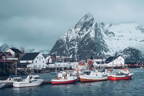 Pier with ships in Hamnoy fishing village on Lofoten Islands