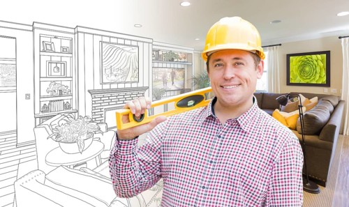 Smiling contractor in hard hat with level over custom living room drawing and photo combination