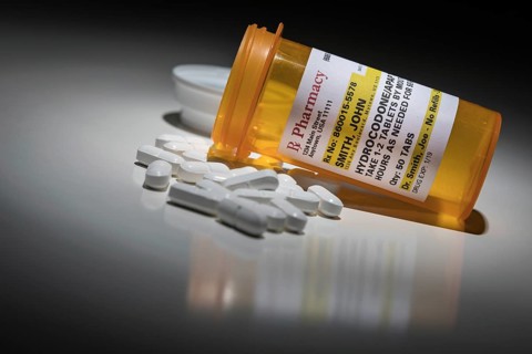 Hydrocodone pills and prescription bottle with non proprietary label. no model release required