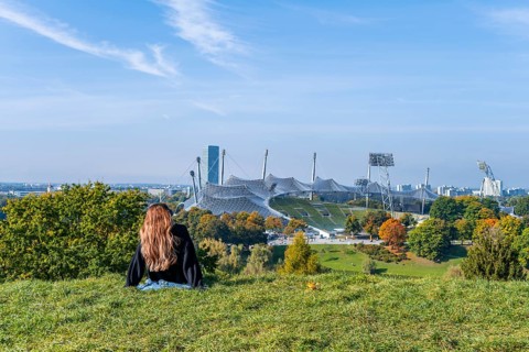 Young woman sitting in the grass