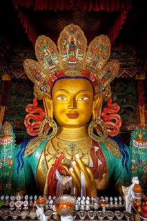 Maitreya Buddha statue face close up in Thiksey Gompa. Ladakh