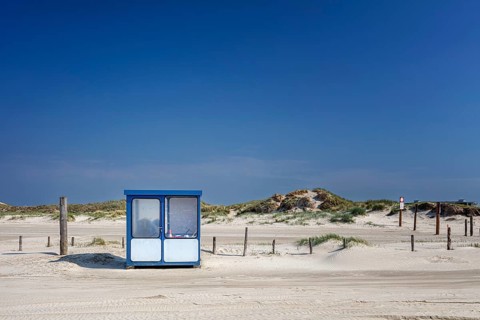 Beach with wooden planks and guard house