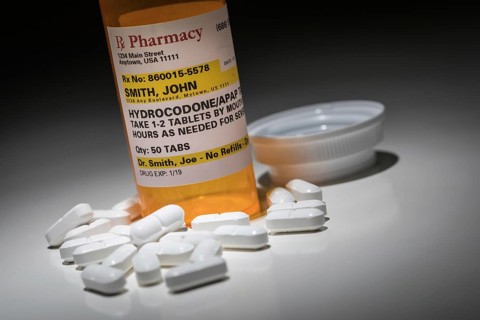 Hydrocodone pills and prescription bottle with non proprietary label. no model release required