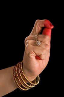 Woman hand showing Kapittha hasta