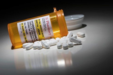 Hydrocodone pills and prescription bottle with non proprietary label. no model release required
