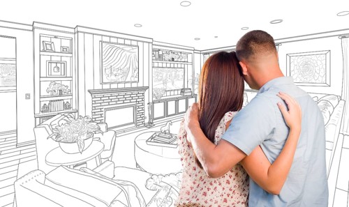 Curious young military couple looking over custom living room design drawing
