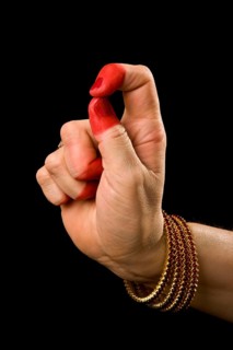 Woman hand showing Kapittha hasta