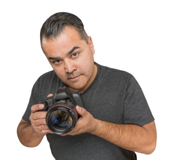 Handsome hispanic young male with DSLR camera isolated on a white background
