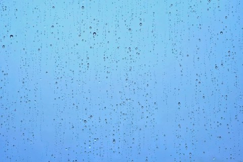 Rain water drops droplets on window glass texture background