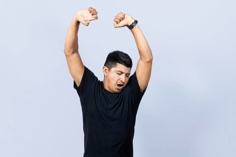 People yawning and stretching his hands