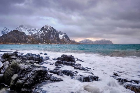 Rocky coast of fjord of Norwegian sea in winter. Vareid