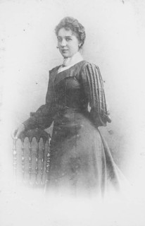 Woman in a dark Sunday dress