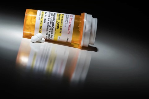 Hydrocodone pills and prescription bottle with non proprietary label. no model release required