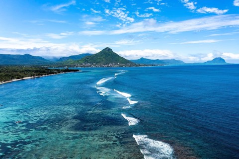 Aerial view of Flic en Flac beach with waves on the reefs