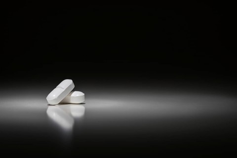 Hydrocodone prescription pills under spot light
