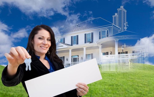 Hispanic woman holding keys and blank sign with ghosted house drawing